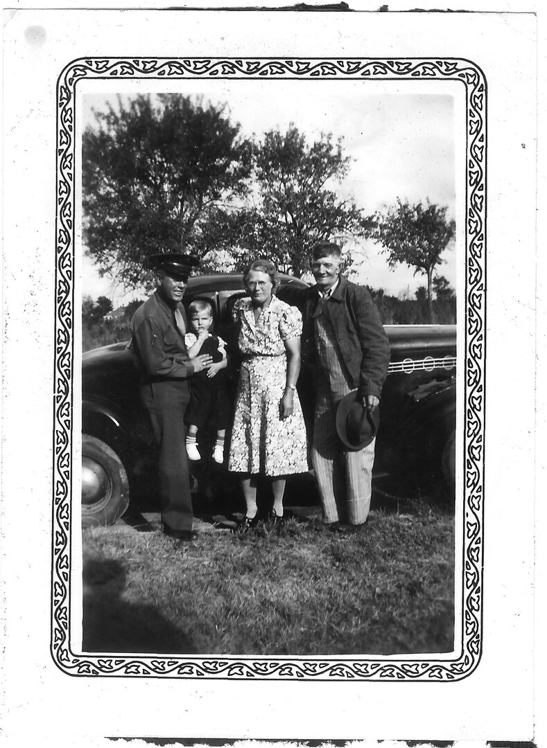 Photograph (100)
1942: Reamsville, KS.  Frank Nelson Ed and Edith Nelson, holding Jerry Lee.
