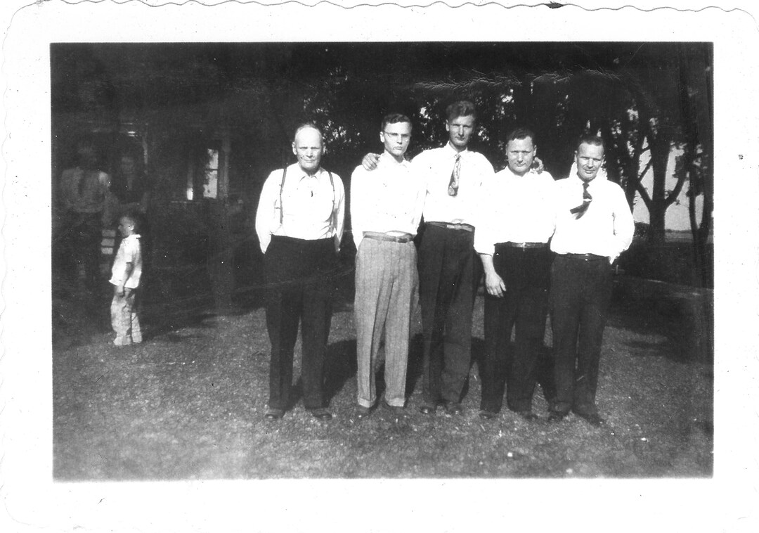 Photograph (111)
1946, Windsor, Wis.  Four McNall brothers/ Lester, Dick, Webb, Ambrose, and father Webster.
