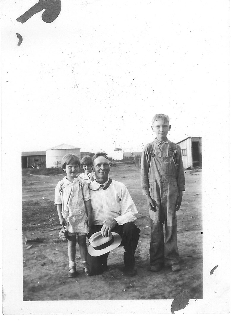 Photograph (147)
1930, Kansas.  Uncle Ben McNall with Alverna, Esther, and Kenny.
